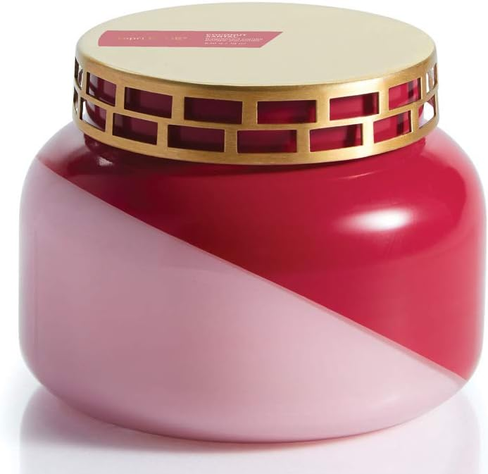 candle in a pink and red two toned jar